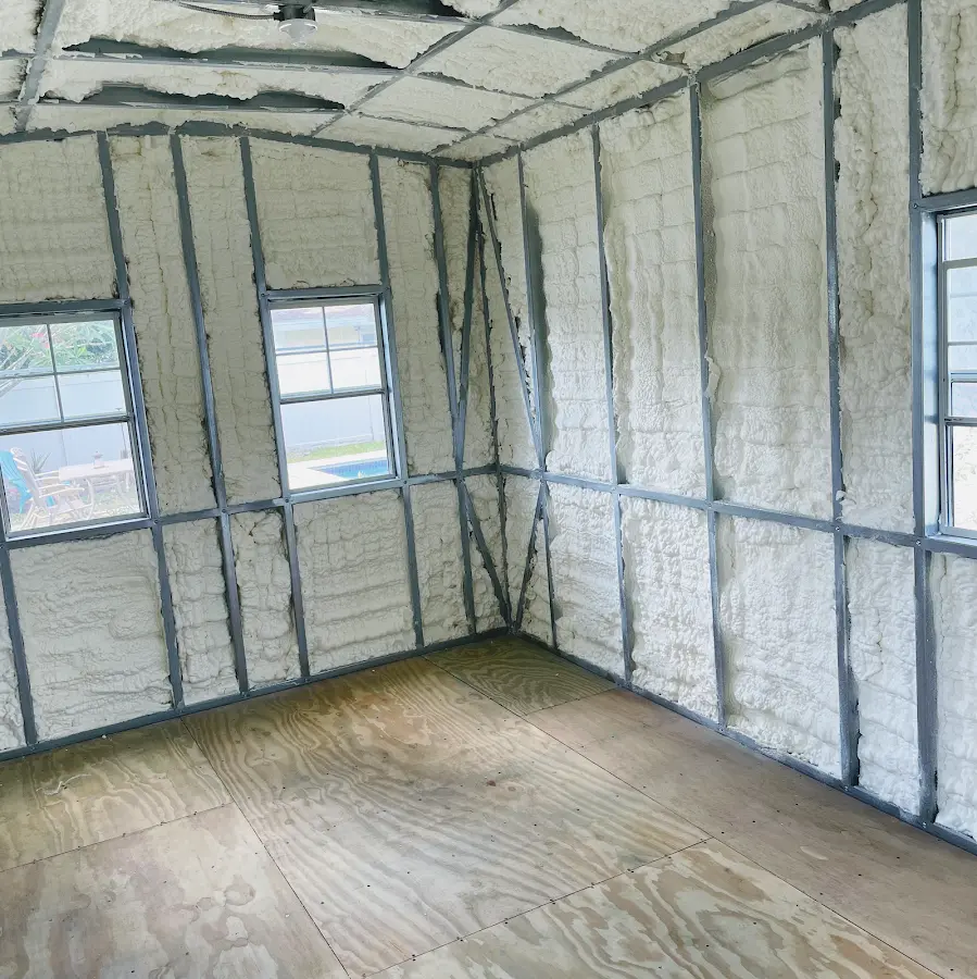 Closed-cell spray foam insulation applied to wall cavities in a residential project in Cottage Grove